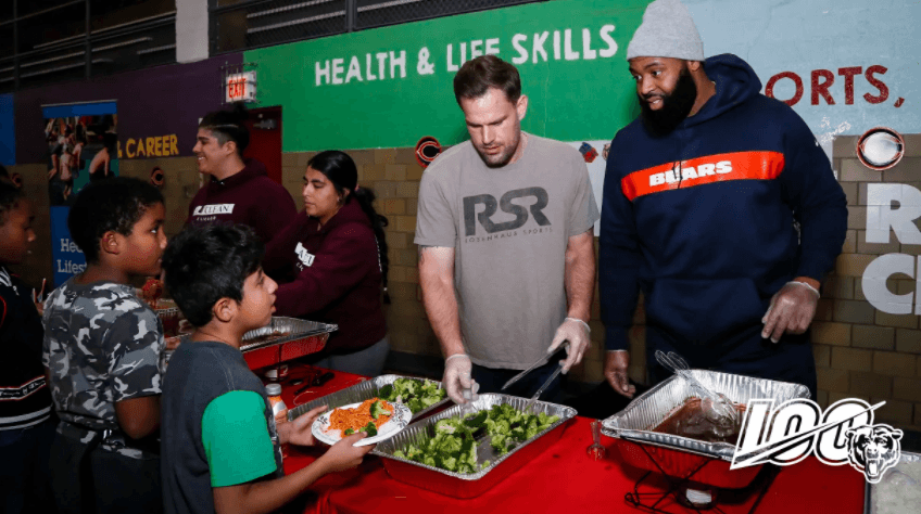 Akiem Hicks serving food